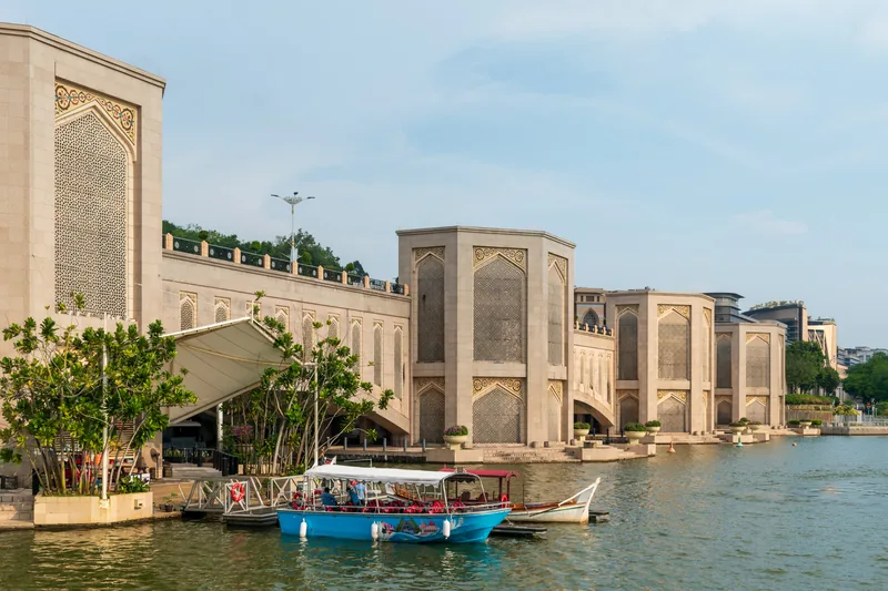Putra Bridge and tour boat on Putrajaya Lake